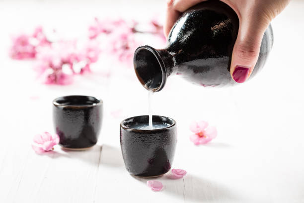 istock Prepared to drink sake with blooming flowers 858692230