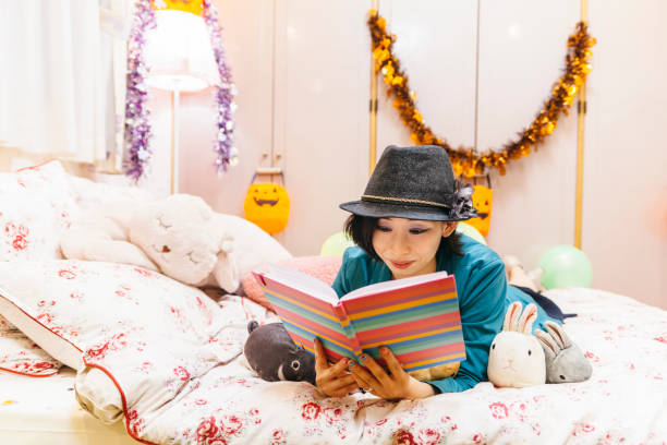 istock Woman Reading Book In Bed 858695900