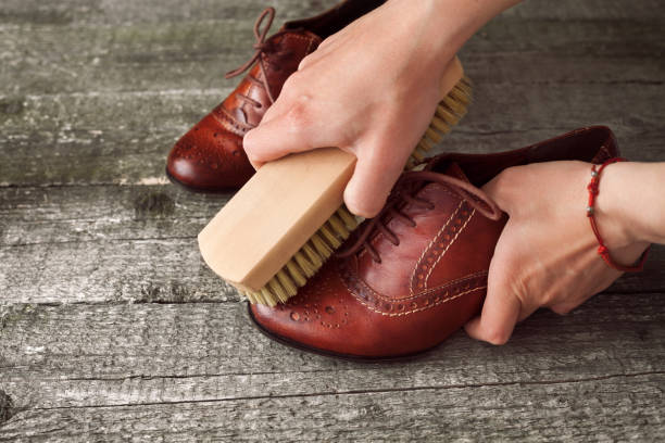 istock Shoe polisher polish shoe with brush 858698914