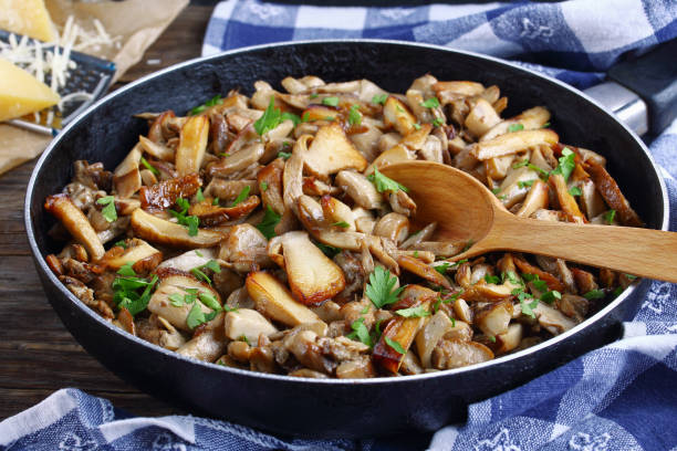 fried porcini with parsley in skillet - recipe ingredient grater cheese grater imagens e fotografias de stock