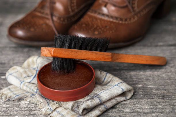 istock Brown shoes with brush and polish cream 858702254