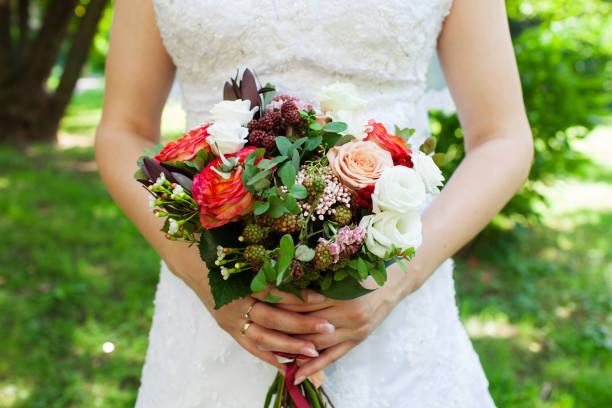 istock Bride with wedding bouquet, closeup 858705876