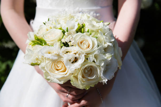 istock Wedding bouquet in bride's hands 858706968