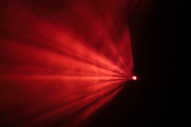 Rays theatrical spotlights on the stage during the performance. Lighting equipment. The lighting designer. Theatrical smoke. The art and creativity.