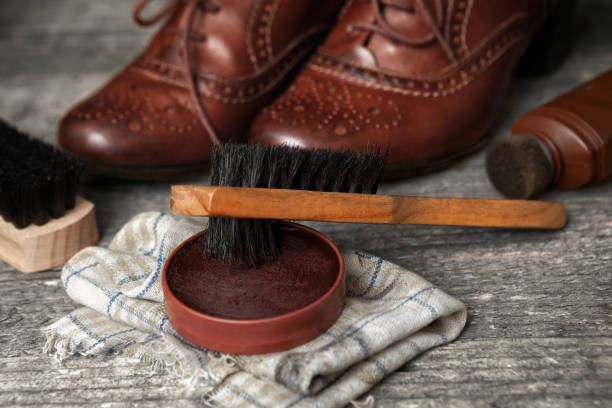 istock Polish cream and brush for cleaning shoes 858707768