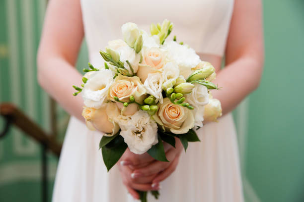 istock Bride with wedding bouquet, closeup 858710582