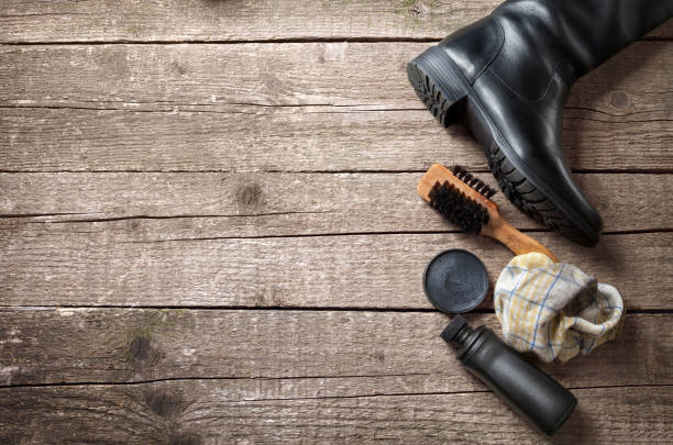 istock Polish cream and brush for boots cleaning 858711516