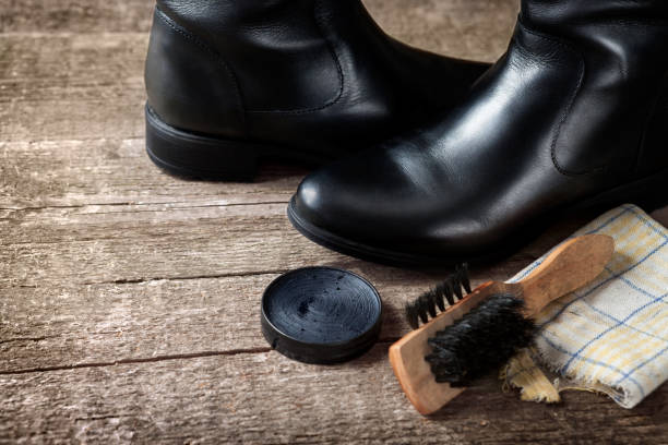 istock Brush,cloth,polish cream and black boots 858711644