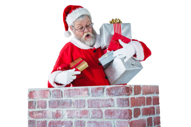 Santa claus placing gift box into a chimney during christmas time