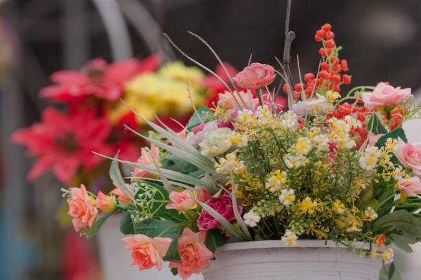 Hanging Artificial flowers pots stock photo