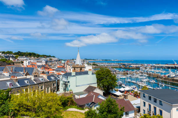 High Angle view over Saint Peter Port Guernsey High Angle view over Saint Peter Port and its harbor and marina. Guernsey, Channel Islands, UK. guernsey city stock pictures, royalty-free photos & images
