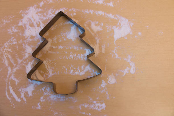 istock Metal form for christmas cookie on table with flour 858725496