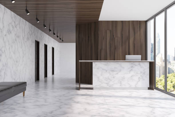 istock Marble reception in a dark wood office 858726472