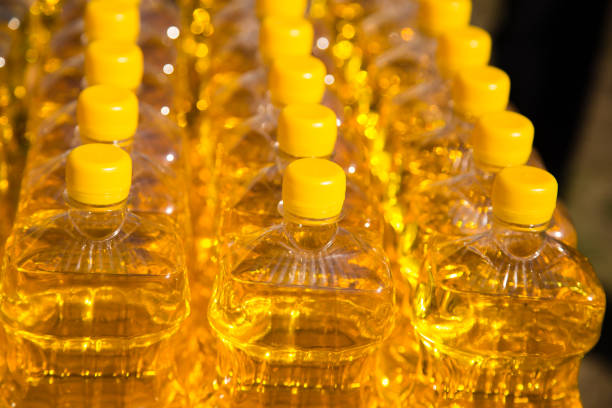 istock yellow vegetable oil in plastic bottles as background 858727144