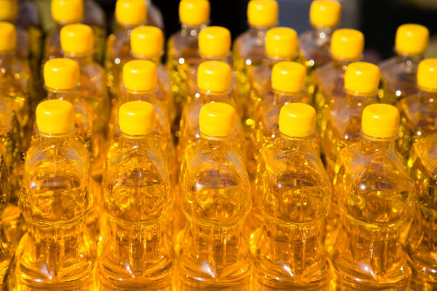 istock yellow vegetable oil in plastic bottles as background 858727196