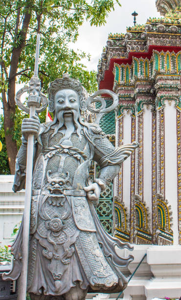 istock Ancient Chinese warrior (Demon) stone statuesat Wat Pho 858727238