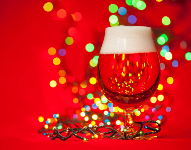 istock Christmas beer with lights on red 858730146