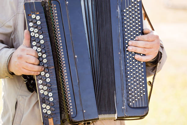 istock musician plays the old accordion 858733040