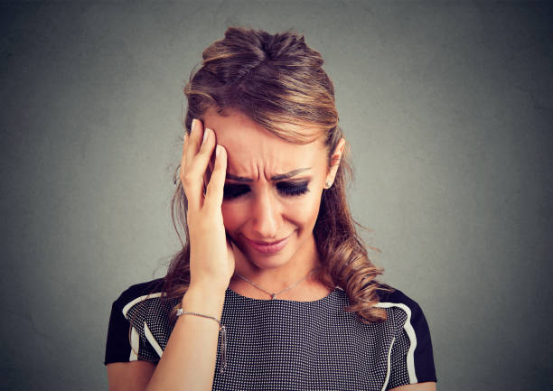 istock Desperate young woman crying 858737976