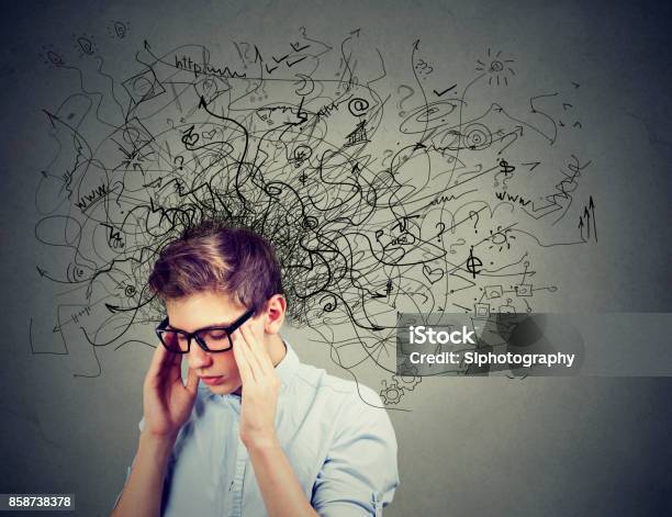 Thoughtful Stressed Man With A Mess In His Head Stock Photo - Download Image Now - Teenager, Mental Health, Attention Deficit Hyperactivity Disorder