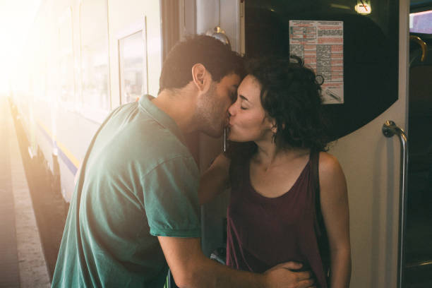 Goodbye kiss in a train station