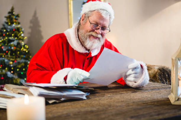 istock Santa Claus reading a letter 858741084