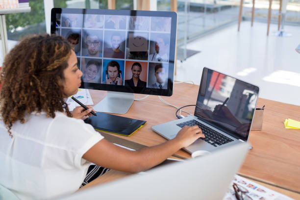 istock Female executive working over graphic tablet at her desk 858756120