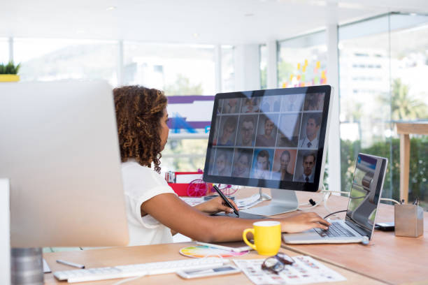 istock Female executive working over graphic tablet at her desk 858756150