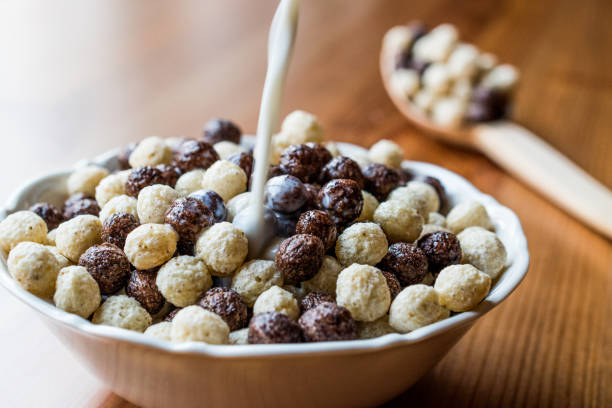 istock Chocolate Corn balls with milk pouring 858756266