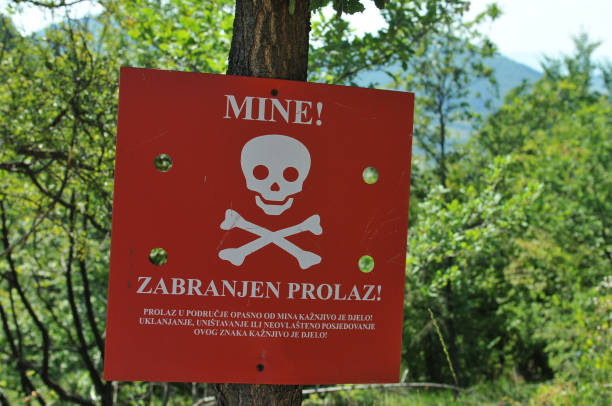Warning minefield stock photo