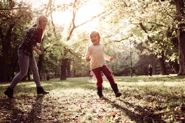 istock Mother with daughter in meadow. 858762168