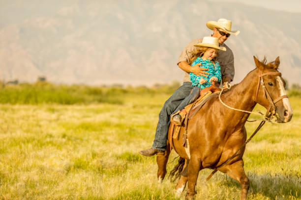 istock Father Daughter Horseback Riding 858766254