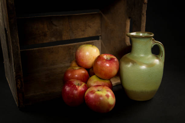 istock Apples and a green vase in a antique apple box 858769410