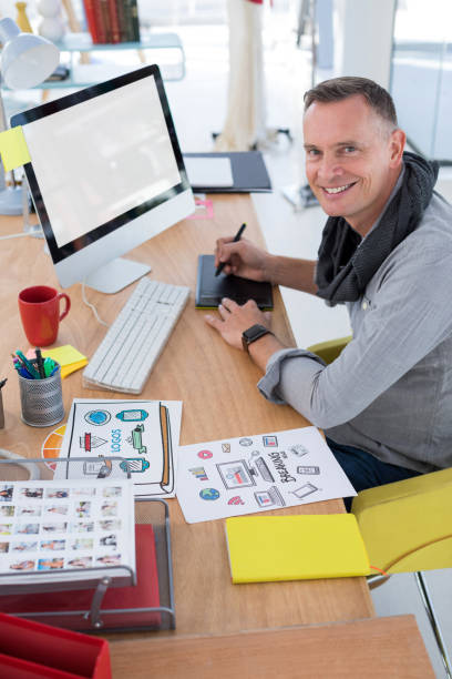 istock Male graphic designer working at desk 858769744