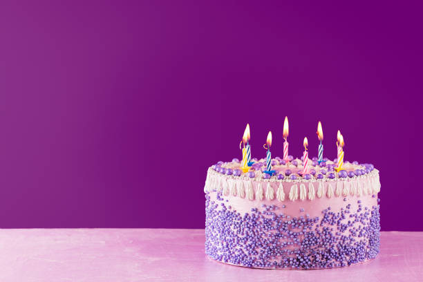 Birthday cake with colorful candles stock photo