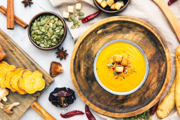 istock Bowl with sweet potato soup and spices. Flat lay styling 858776538