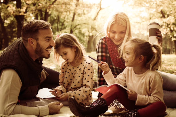 istock Happy family in park. 858776554