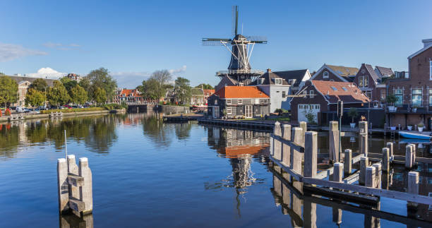 istock Panorama of historic windmill De Adriaan in Haarlem, Netherlands 858778024