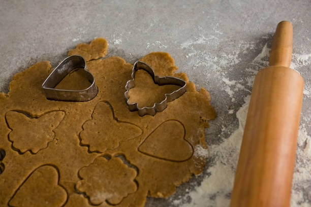 istock Gingerbread dough with flour, cookie cutter and rolling pin 858780588