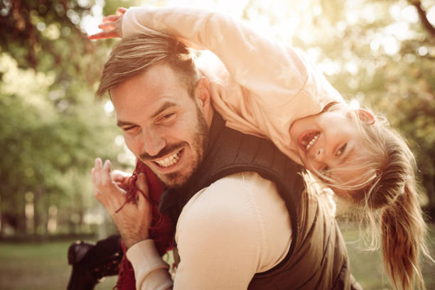 istock Father and daughter in park. 858781490