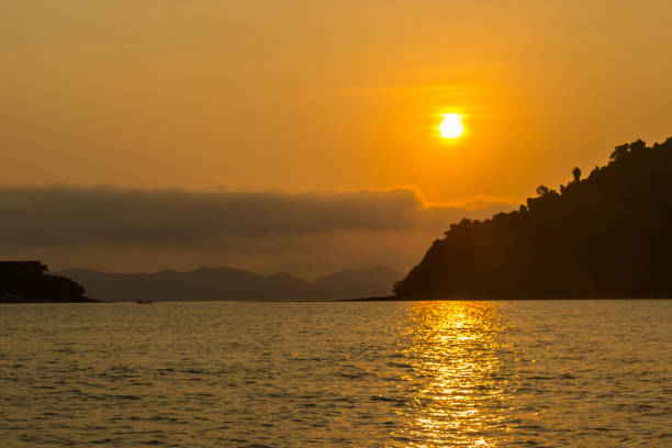 istock Beautiful beach sunrise over the ocean 858781498