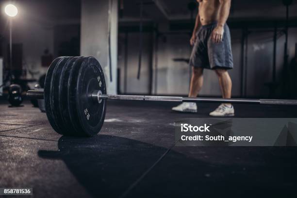 Muscular Young Fitness Sports Man Workout With Barbell In Fitness Gym Stock  Photo, Picture and Royalty Free Image. Image 84038336.