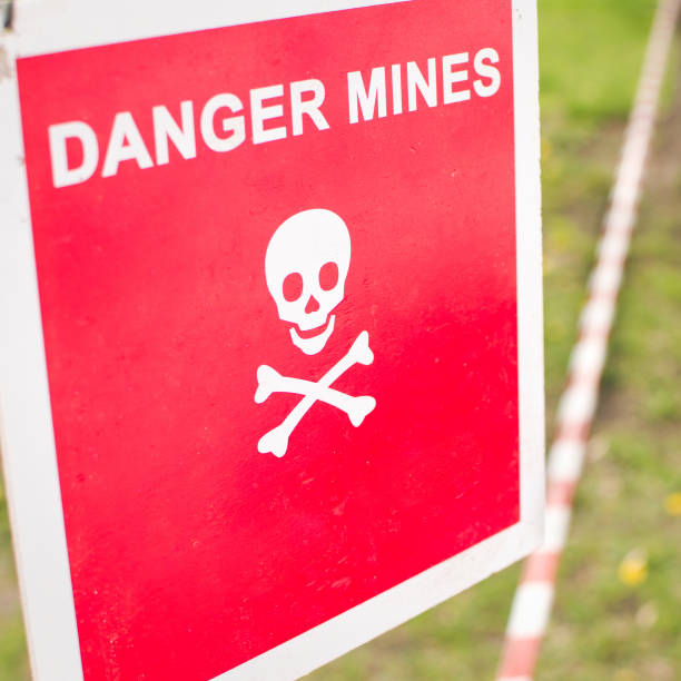 istock Warning sign - Danger mines on a forest 858781560