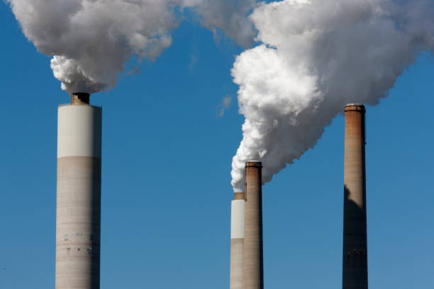 istock Smoke stacks at a power plant 858782904
