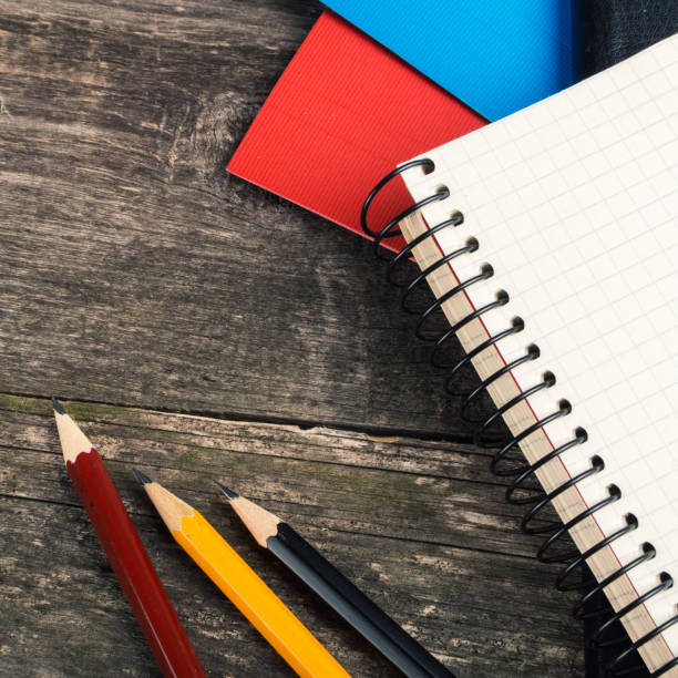 istock Back to School, supplies, notebook on the grey background. square 858783820