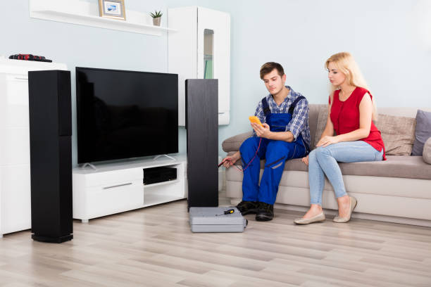 istock Male Technician Checking TV Speaker With Multimeter 858784034