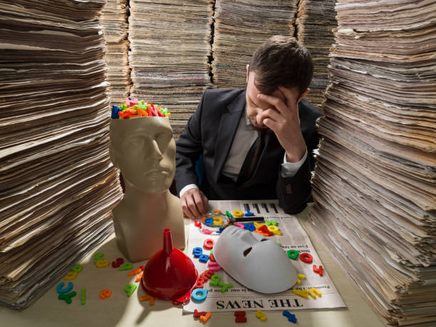 istock Journalist Arranging Letters On Newspaper 858794686