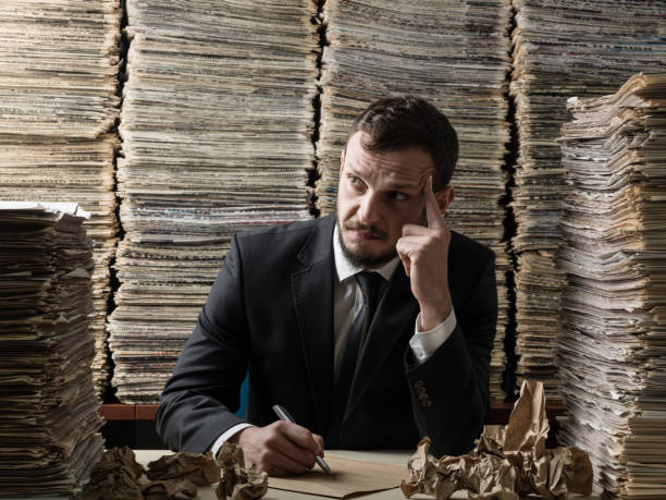 istock Mature Adult Man Contemplating In Library 858797532