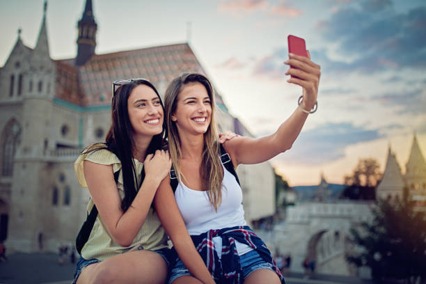 istock Girlfriends are taking selfie/making video call 858819522