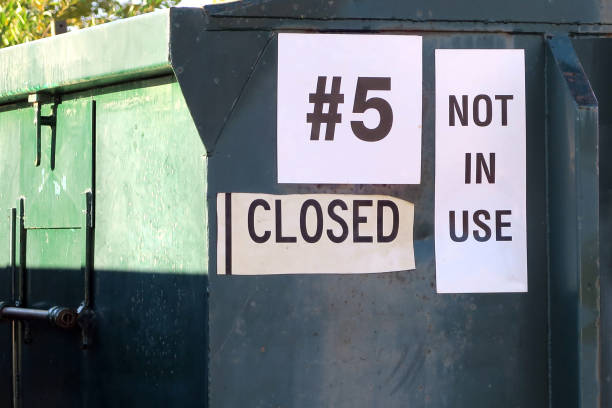 istock Large labeled bins at a community recycle location 858830088